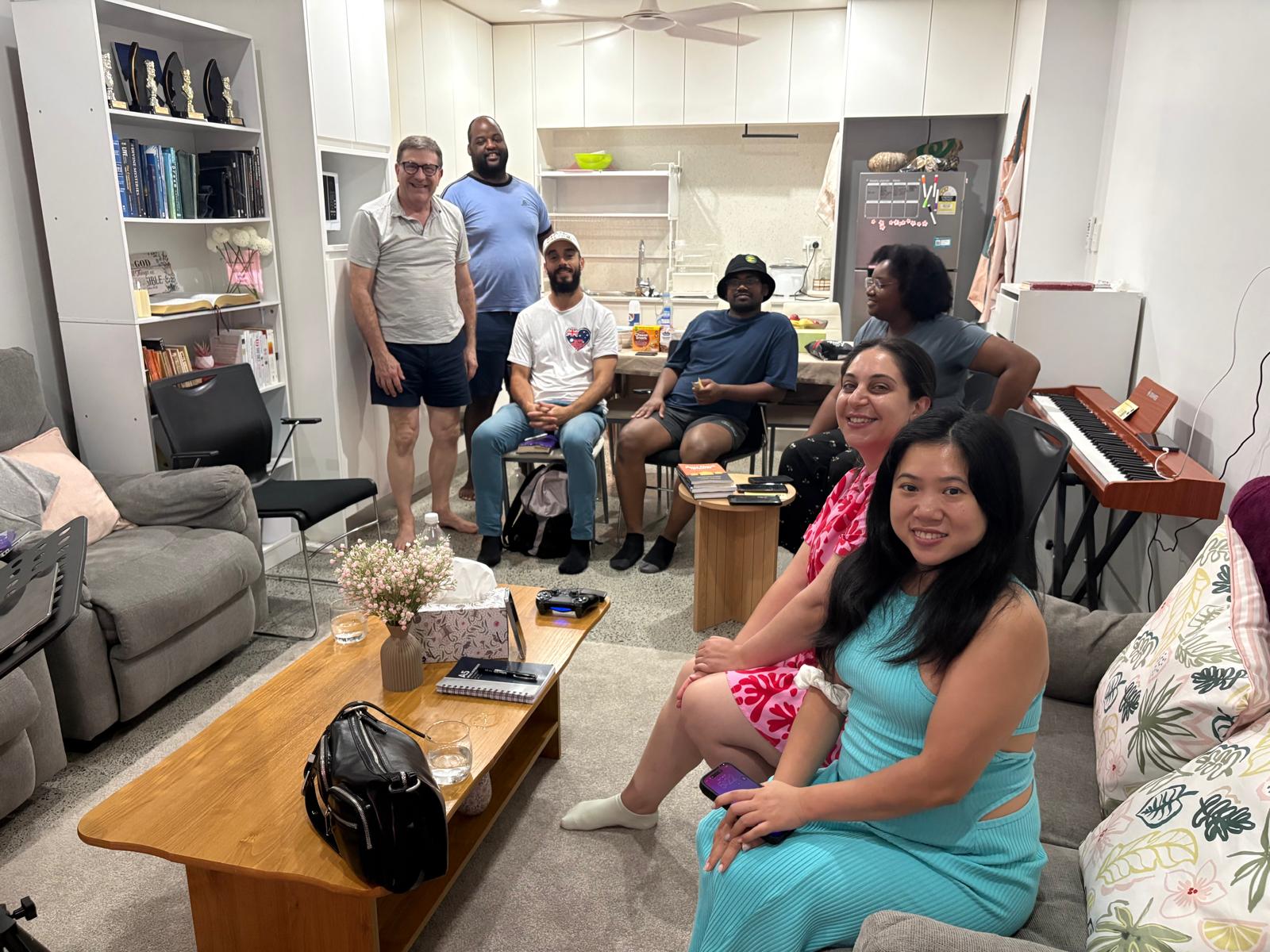 VLAM Sydney house church family gathered around the kitchen in Lidcombe