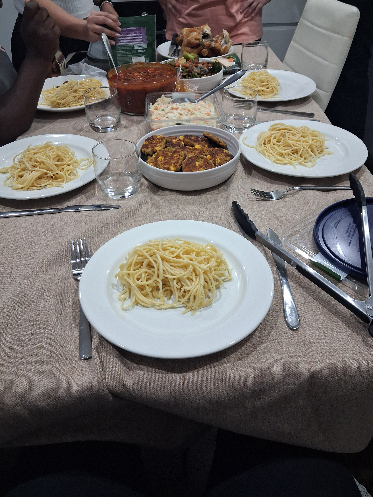Table set with pasta, stew and shared dishes at a VLAM Sydney gathering