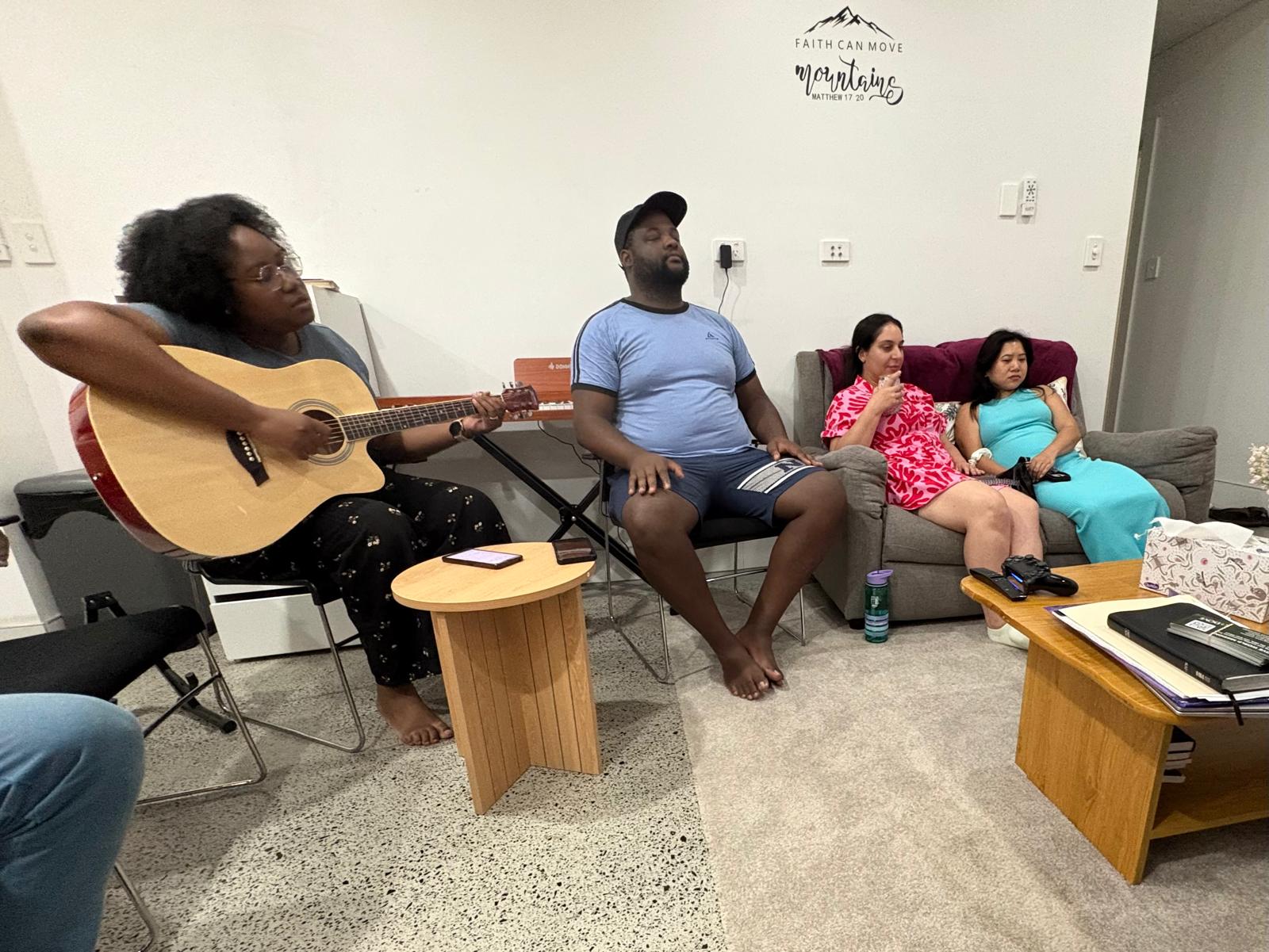 Worship in the living room during VLAM Sydney house church